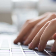 woman typing on keyboard