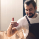 Man smelling coffee in a artisan factory environment