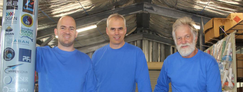Three employees of Black Sky Aerospace standing together and smiling