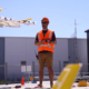 Man flying a drone outside a commercial property