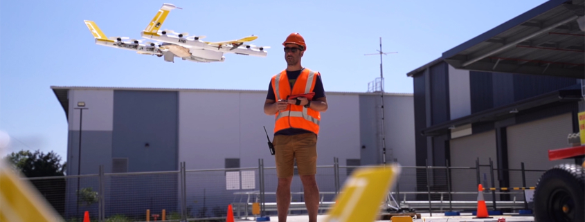 Man flying a drone outside a commercial property