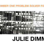Julie Dimmick smiling and standing with her hands in her pockets