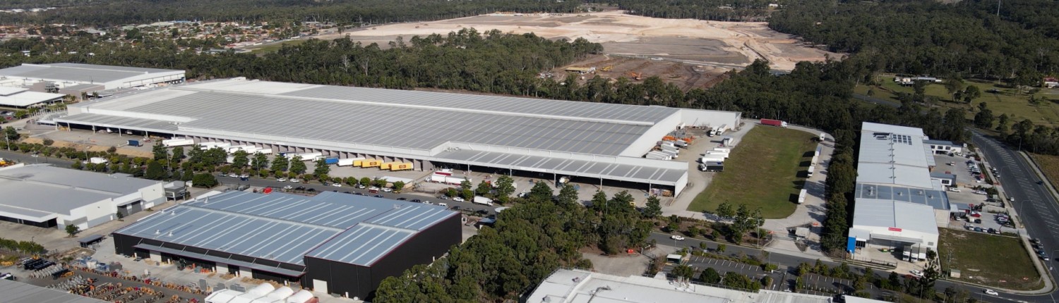 Aerial photo of Metcash warehouse in Crestmead, with land clearing behind it