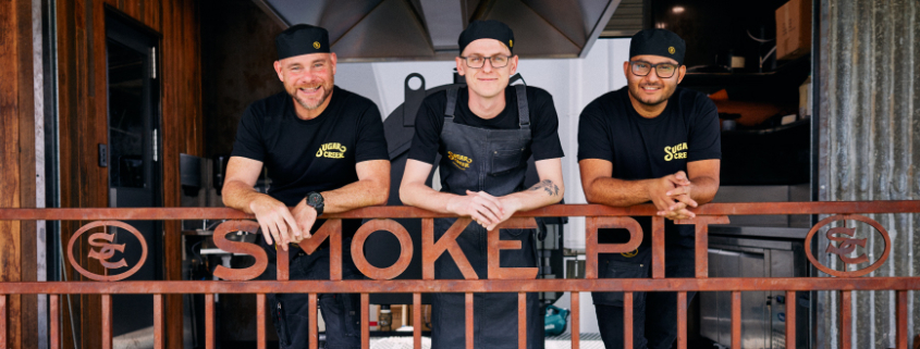 photo of three men at Sugar Creek Smokehouse