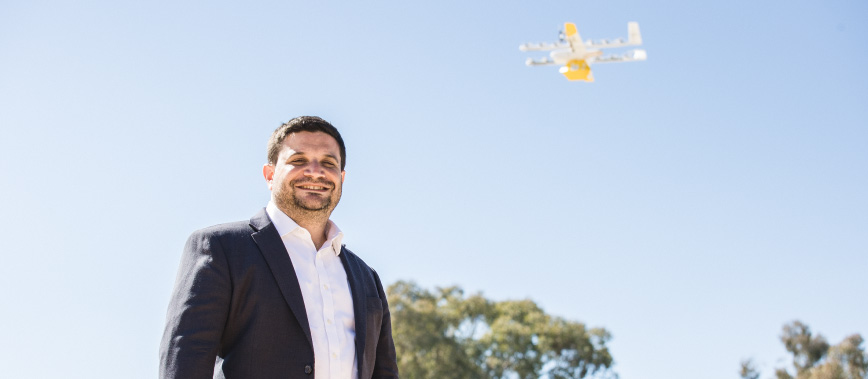 Jesse Suskin from Wing with drone in the sky overhead