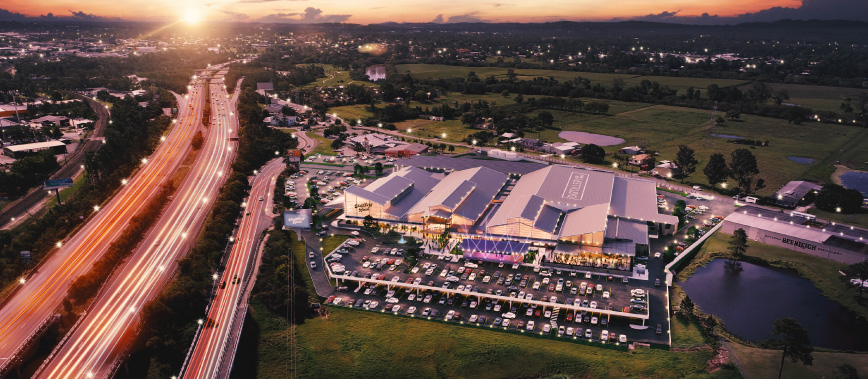 Aerial photo of Distillery Road Market next to motorway, with artist render of markets
