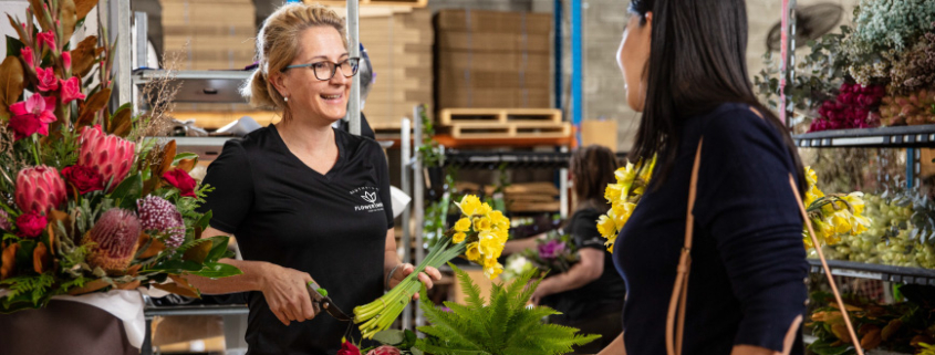 Customer being served at Southside Flower Hub.