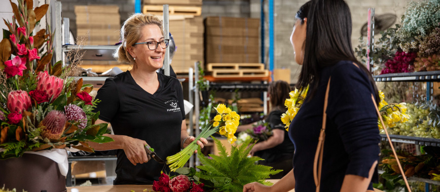 Customer being served at Southside Flower Hub.