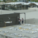 Wing drones launching from shopping centre roof