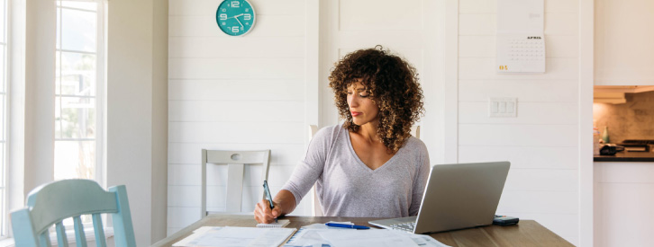 Business women taking notes