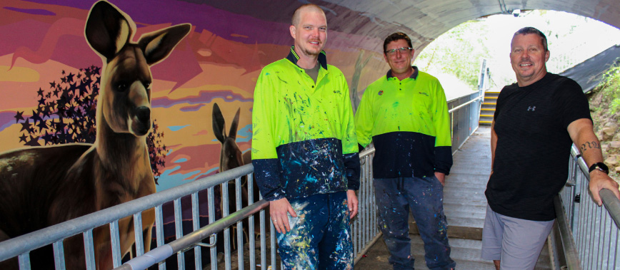 Cr Scott Bannan at the Safe Crossing with mural artists Paul Turnbull and Jay Christensen