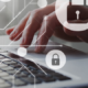 Image_locks in illustrations overlaying on someone typing on laptop