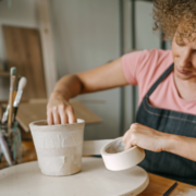 Image_girl with curly hair making pottery