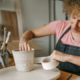 Image_girl with curly hair making pottery