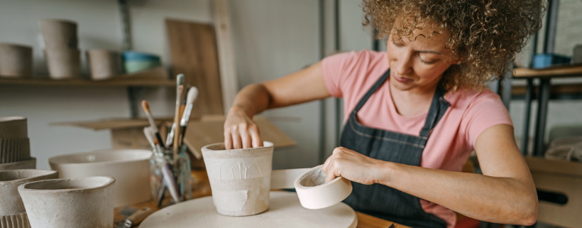 Image_girl with curly hair making pottery