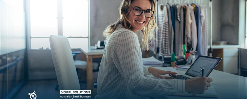 Business woman smiling while taking notes