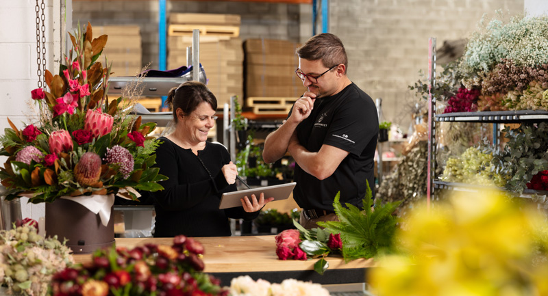 LOED staff working with a business (florist)