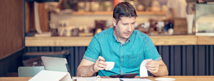 small business owner going through paperwork