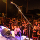 Man singing on stage to crowd at Jimboomba