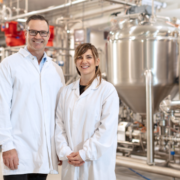 Image_staff wearing white gown standing in front of the machine