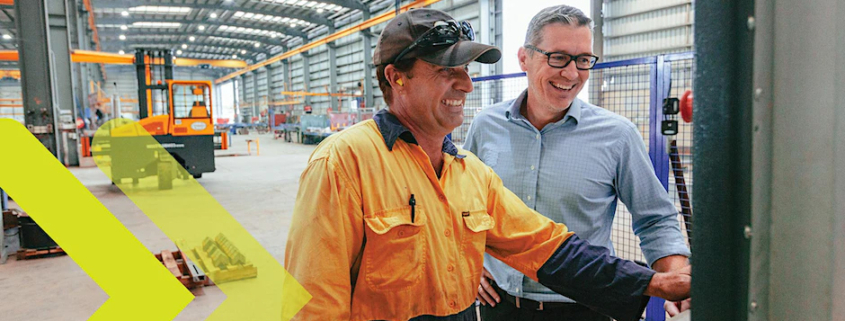 Image_A tradie showing a supervisor the manufacturing machine