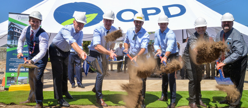 Dignitaries pick up shovels for the Meadowbrook health facility sod turn