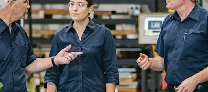 3 colleagues chatting at a manufacture