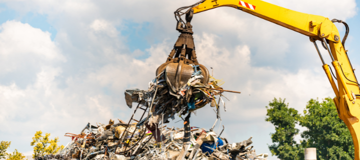 A heavy machine lifting recycled industrial business resources