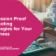 a person typing on a laptop with marketing and advertising icons floating around