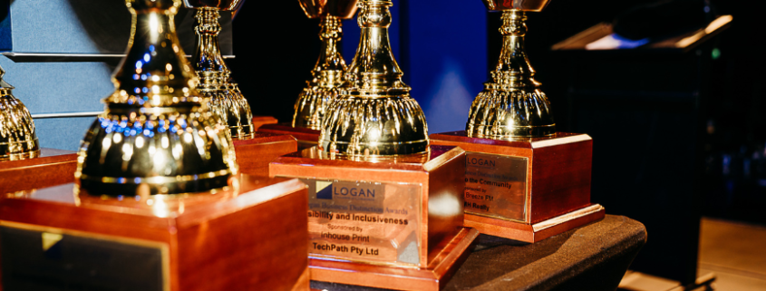 Trophies on the table says 2023 Logan Business Distinction awards