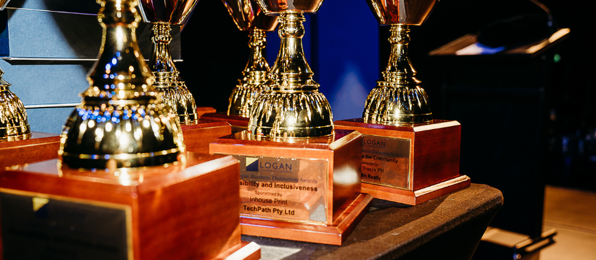 Trophies on the table says 2023 Logan Business Distinction awards