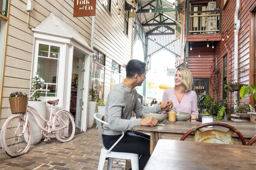 a couple dinning in at a cafe