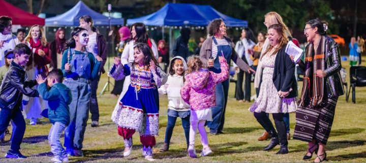 People enjoying a community event in a park