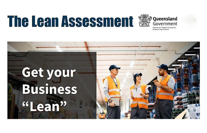 3 people wearing high-vis vest in a warehouse discussing