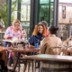 a group of people including people with disabilities dining at Beenleigh Artisan Distillery