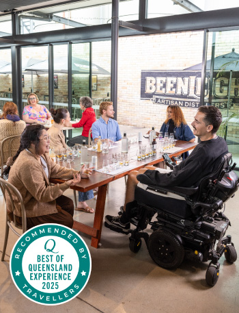 group of people sitting at a table talking