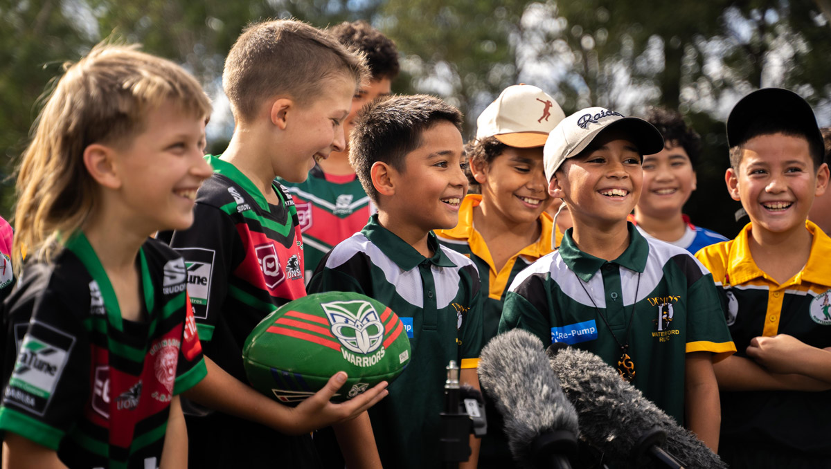 Local Logan rugby league fans gather to hear the announcement about the NZ Warriors launching a new Logan base.